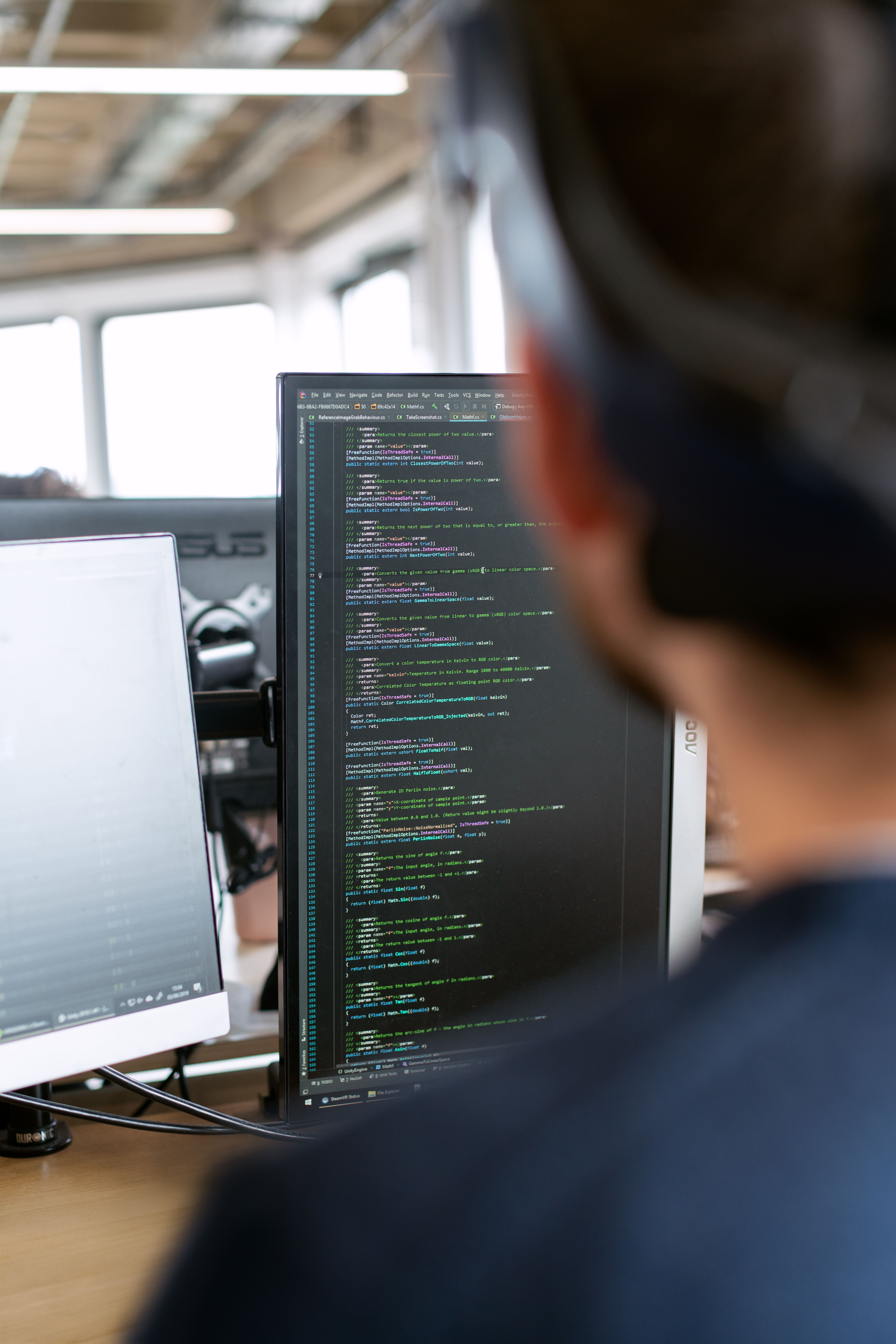 Software development team working on code